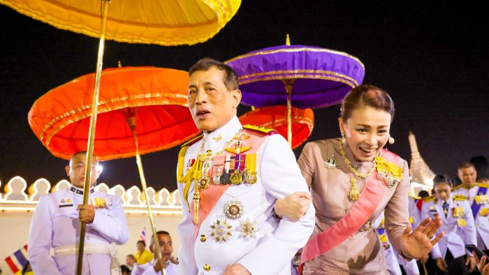 Why are Thai protesters risking 15 years in jail with demonstrations and speaking out against the Thai King and royal family?
