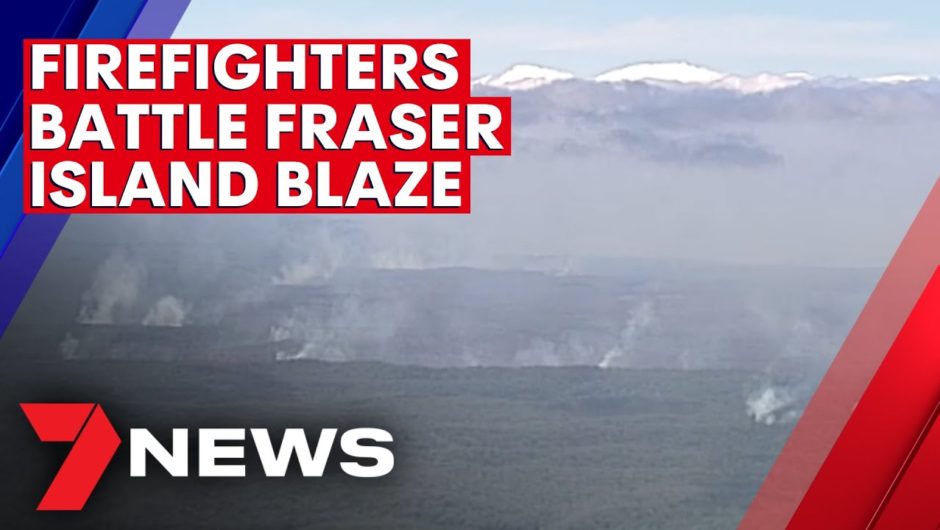 Firefighters battle to stop Fraser Island bushfire | 7NEWS