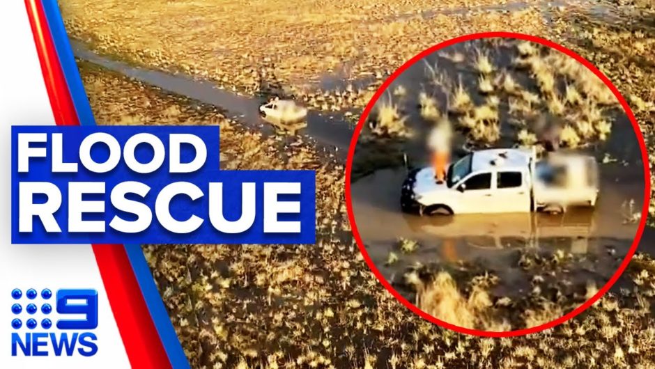 Family rescued after car bogged in floodwaters | 9 News Australia